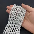 Perle sfaccettate in howlite bianca con venature grigie per la creazione di gioielli - Howlite