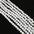 Platte ronde witte parelmoer kralen met iriserende glans voor DIY-sieraden maken - Schijf
