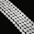Strands of oval natural white mother of pearl shell beads with iridescent luster - Oval