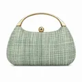 Detail of light green woven clutch bag featuring a gold circular metal handle and sphere lock - Green