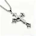 Detailed close-up of triple-layered silver cross pendant with sparkling zircon stones - Black With Rhinestones