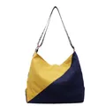 Corduroy hobo bag in yellow and navy color block with ethnic jacquard strap - Blue and Yellow