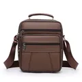 Dark brown leather shoulder bag for men featuring triple front zippers and top handle - Tan