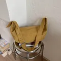 Chic mustard yellow hobo bag in soft faux suede with stylish silver buckle shoulder strap - Yellow