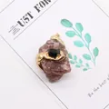 Detailed view of natural raw rose quartz pendant with snake-style gold plated edging - Strawberry Quartz and Black