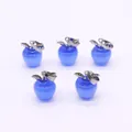 Close-up of five apple-shaped translucent blue pendants with silver leaf metal clasps - Apple Shape / Blue Cat's Eye Stone