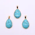 Detailed view of three pear-shaped teardrop pendants with gold plated bezel setting - Blue Turquoise