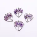 Detailed view of four heart-shaped tree of life pendants with purple amethyst stones - Amethyst