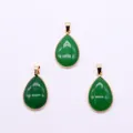 Detail view of teardrop malachite stone pendants with golden electroplated necklace bails - Green Jade