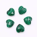 Macro view of 5 faceted heart-shaped malachite stone beads for DIY jewelry making - Malachite