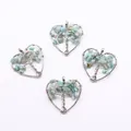 Detail of four heart-shaped tree of life pendants with silver wire wrap and blue stones - Amazonite