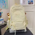 Zaino scolastico giallo crema per studenti con dettaglio fiocco e ricami - Giallo