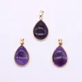 Detailed view of three purple crystal teardrop pendants with polished gold-plated edges - Purple Crystal