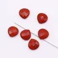 Detailed macro view of faceted red jasper heart stone bead with natural black veins - 1.5cmx1.5cm / Rainbow Stone