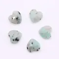 Macro shot of five faceted heart-shaped natural stone pendants for DIY necklace jewelry - Natural Stone