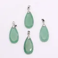 Detailed view of four faceted green natural stone teardrop pendants with silver bails - Green Aventurine