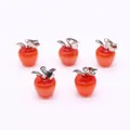 Set of five red cat eye stone apple pendants with silver leaf details on white background - Apple Shape / Red Cat's Eye