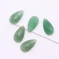 Macro shot of five faceted green aventurine teardrop gemstones for DIY jewelry making - Green Aventurine