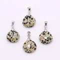 Detailed view of faceted teardrop dalmatian jasper pendants with silver metal clasps - Dalmatian Jasper