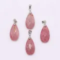 Detailed view of four faceted pink natural stone teardrop pendants with silver bails - 13x25mm / Rhodonite