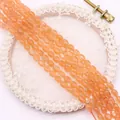 Macro detail van gepolijste oranje kattenoog ovale kralen voor DIY sieraden en ambachten - Oranjerood / 4x6MM