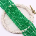 Detail showing faceted oval cat's eye beads in emerald green for DIY jewelry - Emerald Green
