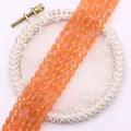 Detailed view of faceted orange teardrop natural stone beads for DIY jewelry making - 4x6MM / US 3