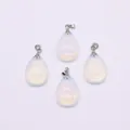 Set of 4 pear shaped milky white translucent stone pendants with silver metal clasps - Opal