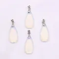 Set of four teardrop-shaped faceted opal pendants with silver metal clasps on white base - Opal
