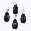 Polished black faceted teardrop stone pendants with silver clasps on white surface - 13x25mm / Black Agate