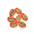 Detailed view of colorful painted natural cowrie shells with geometric patterns for DIY jewelry - Size 3 / 20 Pieces Set