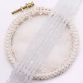 Perle di opale bianco a goccia sfaccettate per collane fai-da-te su sfondo pizzo - US 12