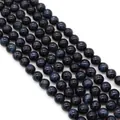 Macro shot of polished blue tiger eye stone beads with natural silk luster for DIY jewelry - Blue (No. 9)