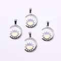 Detailed view of celestial sun and moon pendants with opal stone on white background - Opal