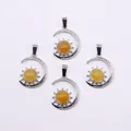 Detailed set of silver sun and moon pendants with centered yellow gemstones for DIY necklaces - Topaz