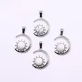 Detail view of four silver sun and moon pendants with white natural stone on white background - Howlite