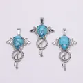 Gothic bat wing key pendant featuring teardrop turquoise and silver metal finish - Blue Turquoise