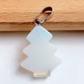 Macro detail of Christmas tree opalite pendant with polished silver metal bail and translucent finish - Opal