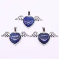 Macro shot of three heart-shaped lapis lazuli pendants with silver angel wings detail - 30x53mm / Lapis Lazuli