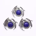 Macro shot of silver dragon-wrapped lapis lazuli pendants with vintage finish - Lapis Lazuli