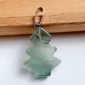 Macro view of Christmas tree shaped green fluorite gemstone pendant with silver bail - Green Fluorite