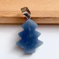 Macro detail of Christmas tree shaped blue lapis lazuli pendant with silver clasp link - Blue Aventurine