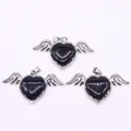 Blue goldstone heart pendant with silver angel wings detail and starry texture finish - 30x53mm / Blue Sandstone