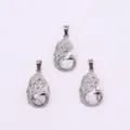 Silver peacock pendant with teardrop-shaped white turquoise stone in a three-piece display - Howlite