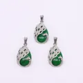 Peacock shaped silver pendant with green teardrop stone and zircon inlay accents - Malay Jade