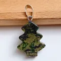 Christmas tree shaped natural green stone pendant with silver clasp on white background - Green Eye Stone