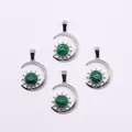 Silver crescent moon and sun pendants set with green malachite stones in ethnic retro style - Malachite