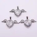 Three heart-shaped white turquoise angel wing pendants with silver metal plating - 30x53mm / Howlite