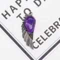 Detail of vintage silver angel wing pendant with purple stone on a white gift card - 21x58mm / Purple Crystal