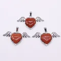 Silver-plated angel wings heart pendant featuring sparkling reddish-brown goldstone - 30x53mm / Gold Sandstone
